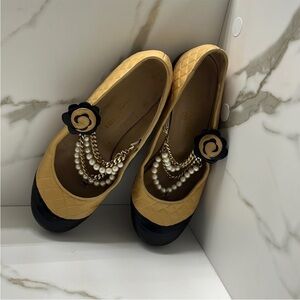 AUTHENTIC CHANEL Black and Tan Flats with Pearl Embellishments